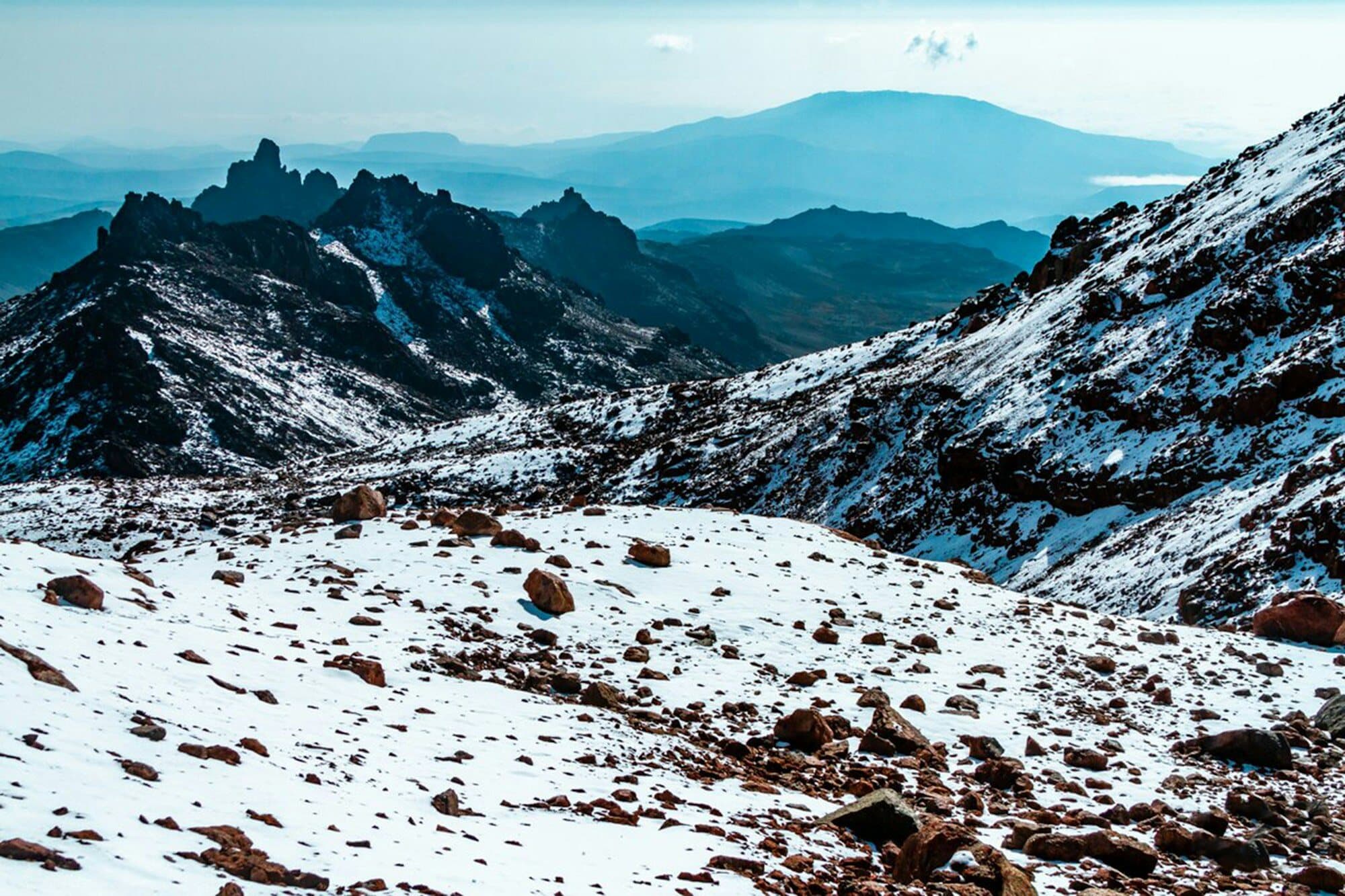 Snow-covered rocky ridges high on Mount Kenya